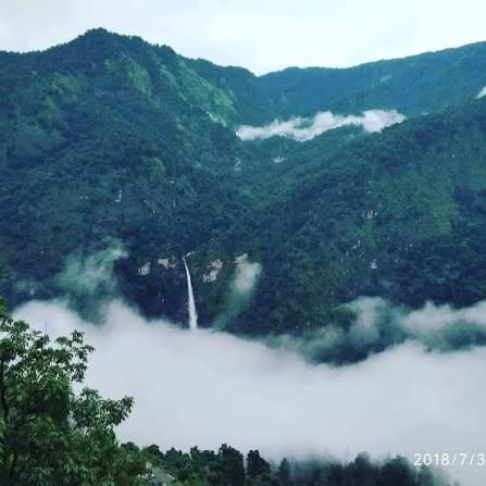 Traditional Kumaoni village with stone houses and terraced fields